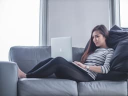 Woman setting up the family dashboard on her laptop